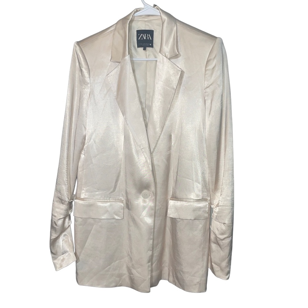 A set of jacket and pants in a shiny pearl color.  Nice fabric